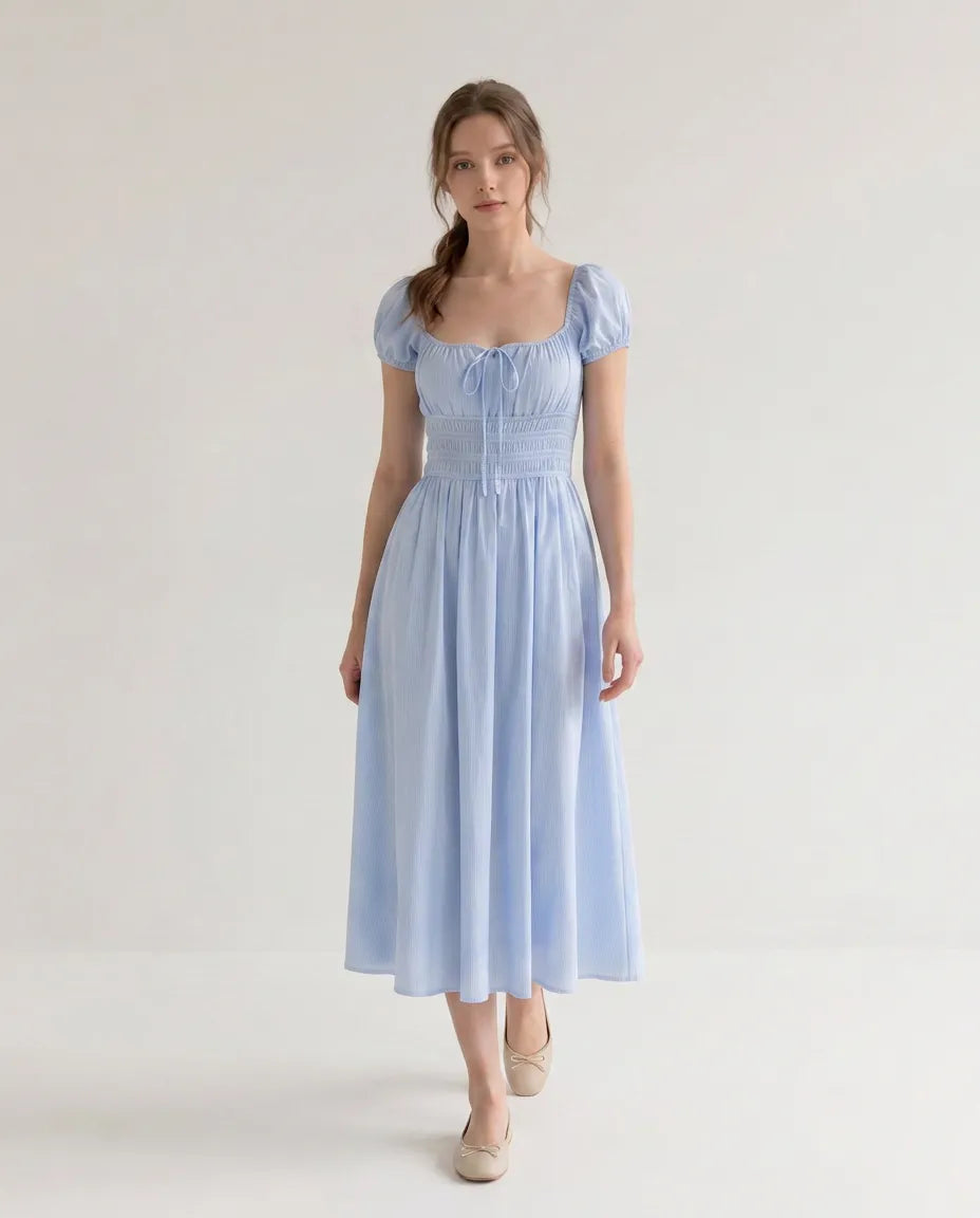 Side view of the Celeste Midi Dress in blue